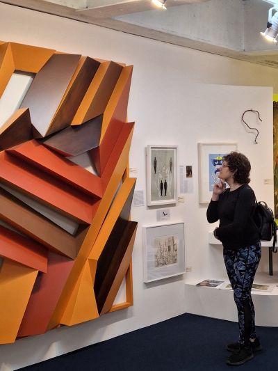The museum night coordinator looking at an art piece